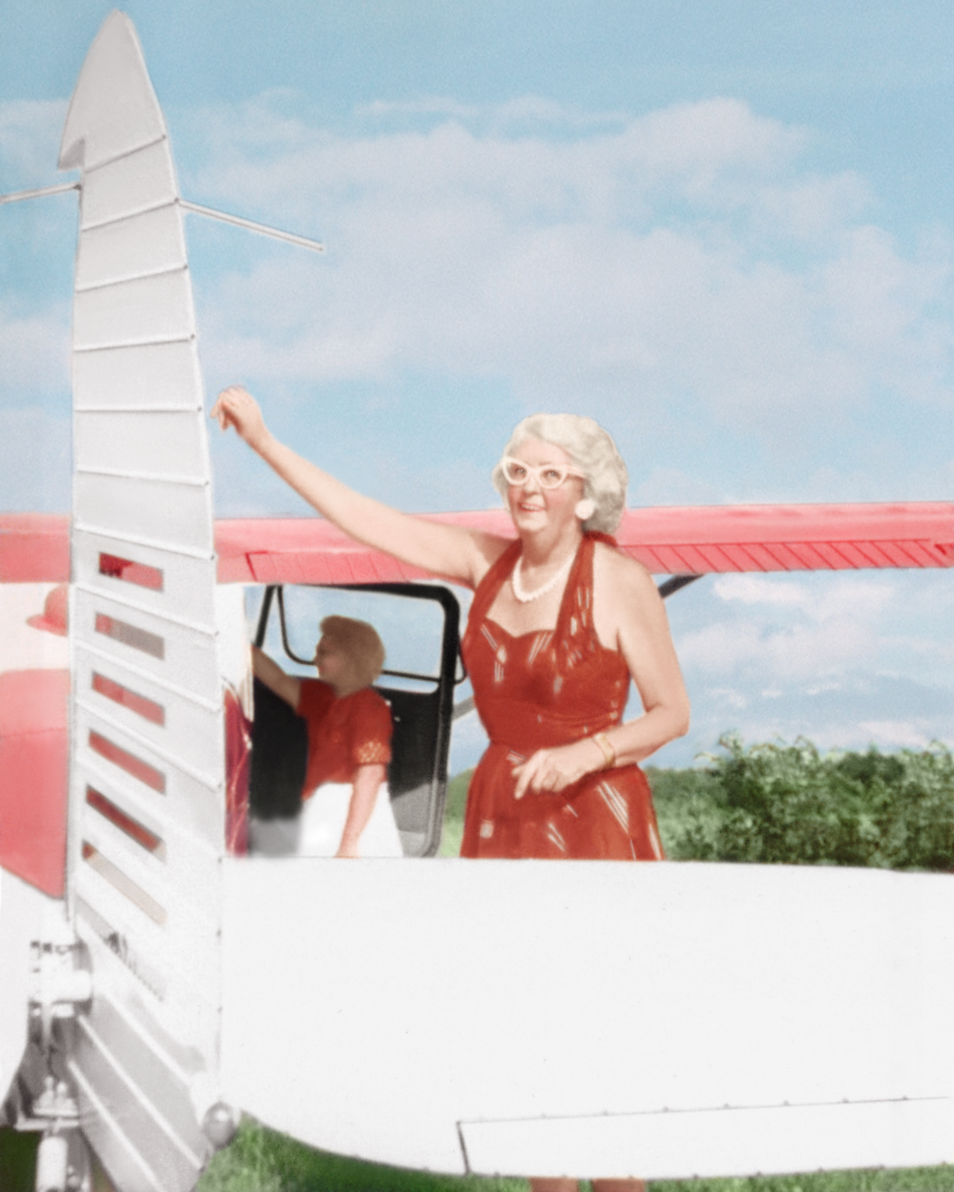 Mildred Devine Hurt with her Cessna 170 plane, 1950s